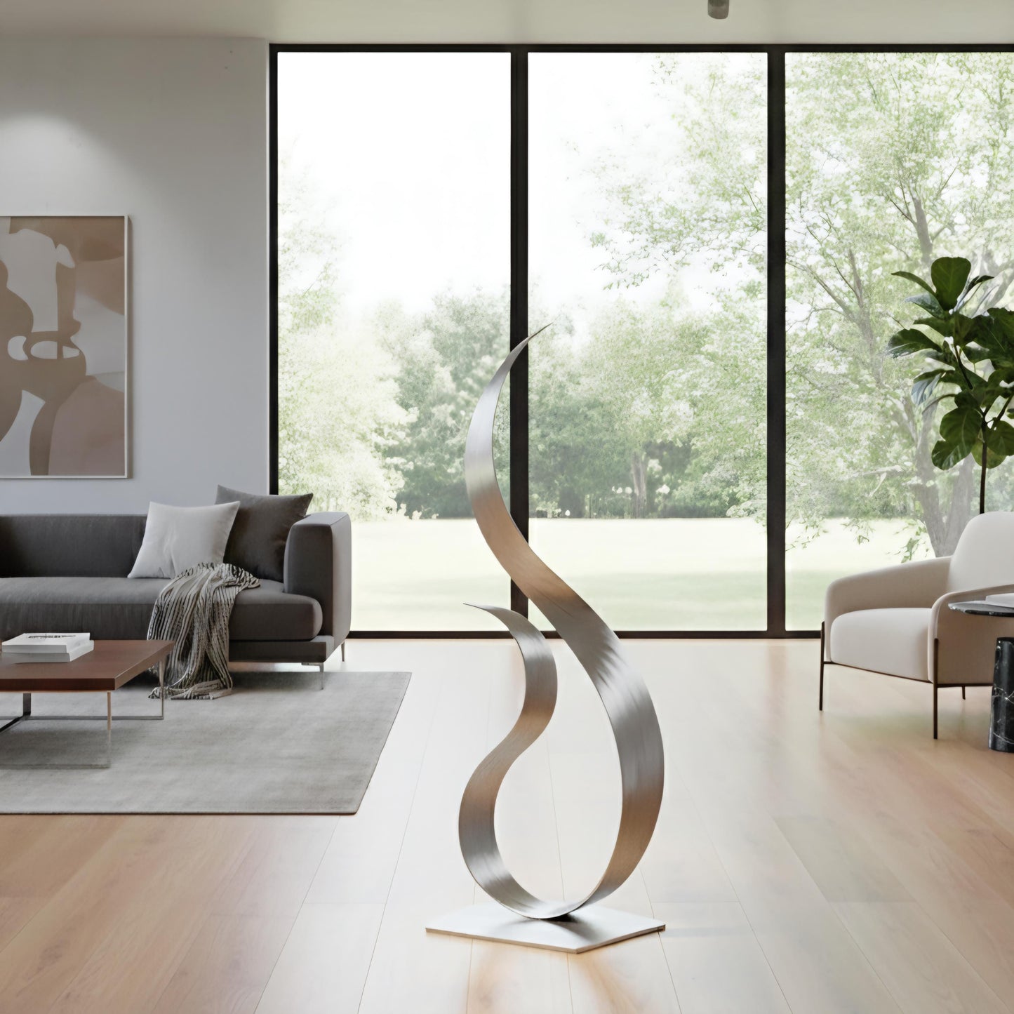 a modern living room with a large window overlooking a lush green outdoor area. The room is furnished with a gray sofa, a coffee table, and a large abstract sculpture in the center.