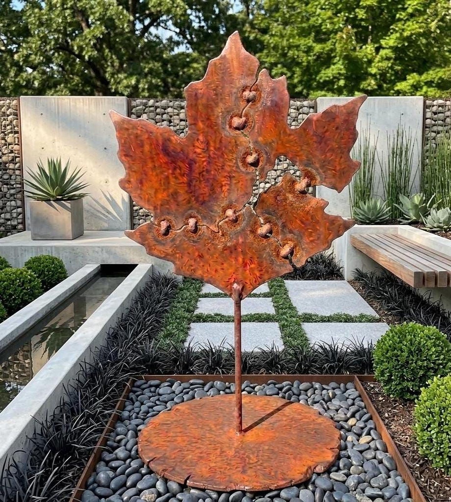 a large, rust-colored metal sculpture of a leaf, which appears to be a unique and eye-catching piece of art. The sculpture is situated in a garden setting, surrounded by various plants and rocks, creating a visually appealing and harmonious outdoor space.