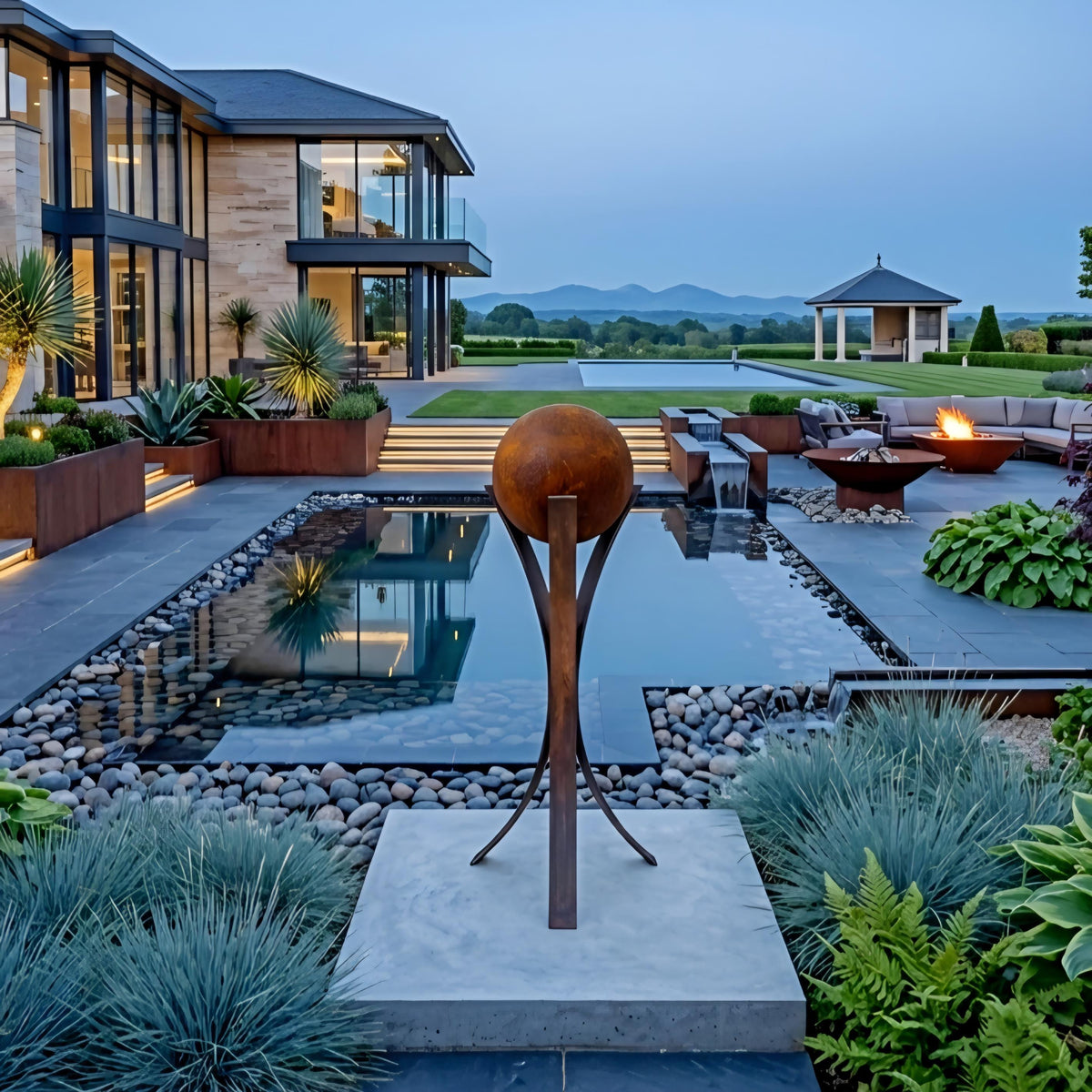 a luxurious outdoor living space with a large swimming pool, surrounded by a well-manicured garden with various plants and a sculpture. The pool is illuminated, creating a serene and inviting atmosphere. In the background, there is a modern house with a spacious patio and a gazebo, adding to the overall elegance of the scene.