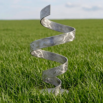 A metal spiral sculpture stands in a grassy field, its intricate design and curved form creating a visually striking contrast against the natural surroundings.
