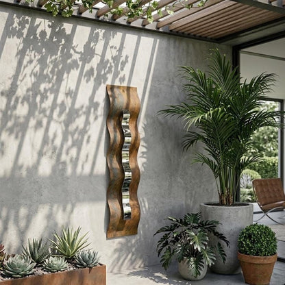 a modern outdoor patio with a concrete wall, a wooden sculpture, and various potted plants.