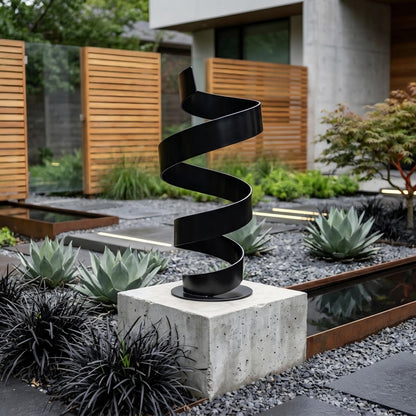 a modern garden sculpture with a spiral-like design, situated in a well-maintained garden with various plants and a concrete base.