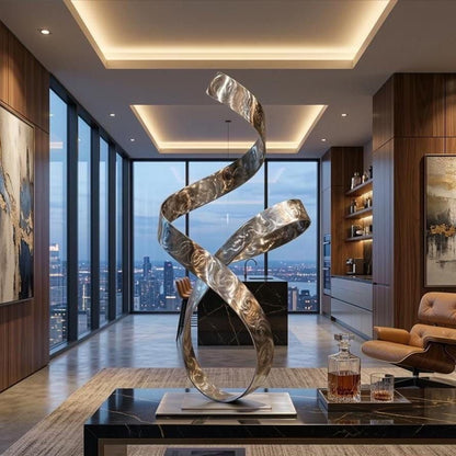 a modern living room with a large, abstract metal sculpture as the focal point. The sculpture has a curved, metallic design that resembles a ribbon or a wave. The room is well-lit, with large windows offering a view of the city skyline. The furniture includes a leather chair and a coffee table, creating a comfortable and stylish living space.