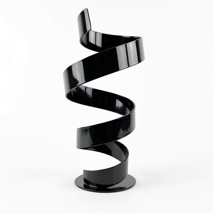 A black spiral sculpture stands alone against a white background.