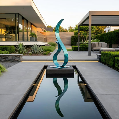a modern garden with a large, abstract sculpture in the center of a reflective pool, surrounded by lush greenery and a contemporary building in the background.