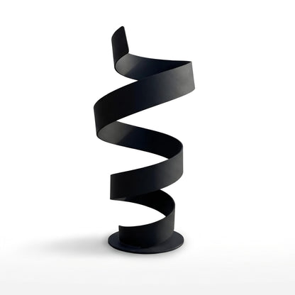 A black spiral sculpture stands alone against a white background.