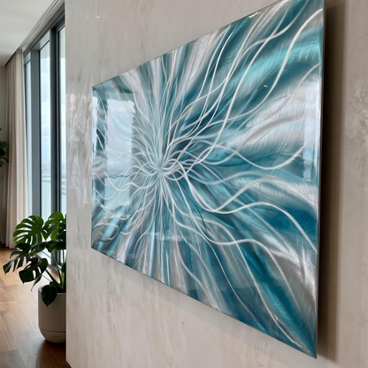 a painting hanging on a wall next to a potted plant