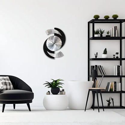 a black chair and a white wall with a mirror
