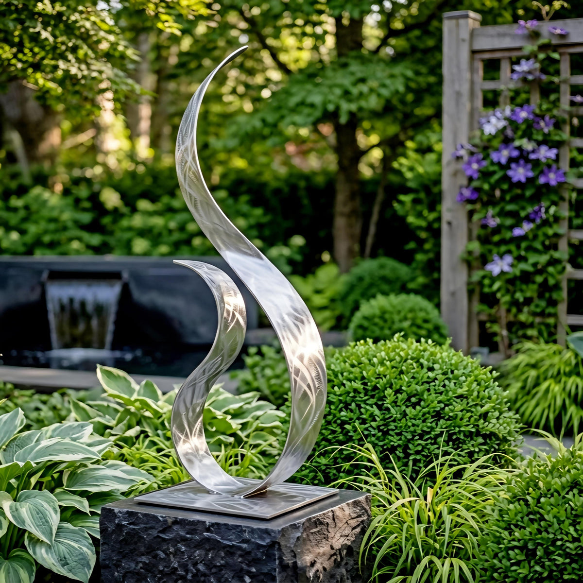 A modern, abstract metal sculpture stands in a lush garden, surrounded by vibrant greenery and flowers.