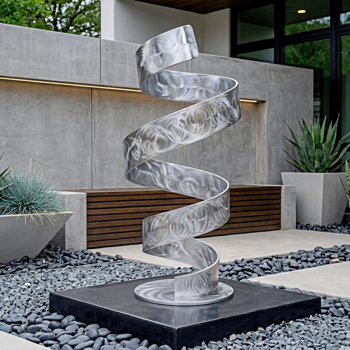 a modern, abstract metal sculpture with a spiral design, situated in a garden setting with a wooden bench and potted plants.