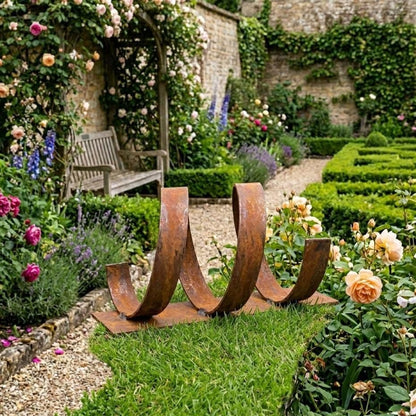 A well-maintained garden with a wooden bench, a winding metal sculpture, and a variety of colorful flowers and shrubs.