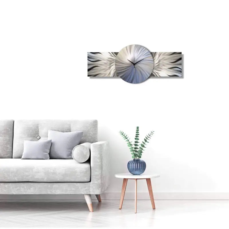 a white couch with a blue and white wall clock