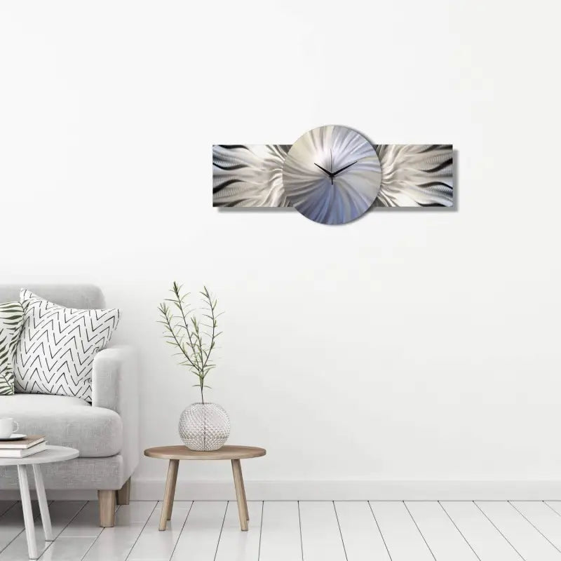 a white couch with a grey and white wall clock