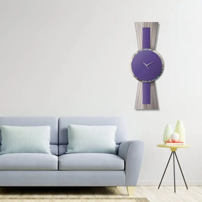 a blue couch in a living room with a clock on the wall