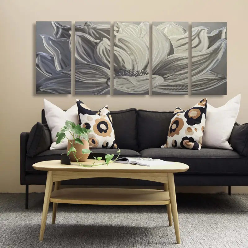 a living room with a couch and two paintings